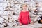 Female shop assistant demonstrating assortment at textile shop