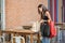 Female shopper putting shopping bag on table and finding something