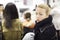 Female shopper queuing in line at cashier.