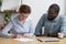 Female signing job contract sitting together with company owner