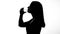 Female silhouette drinking glass of water, restoring ph balance, weight loss