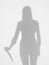 Female silhouette holding a knife behind diffuse surface