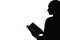 female silhouette reading hobby woman open book