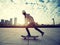 Female skateboarder riding with skateboard