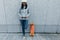 Female skateboarder using smartphone