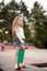 Female skater hangout at the skate park on sunset .Laughing and fun. young girl