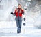 Female skier with skis and poles