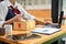 A female small online shop owner preparing shipping package. cropped shot