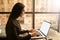 Female smart university student learning online via pc laptop computer with empty mock up copy space display