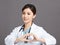 Female  smiling cheerful health care doctor hand making heart sign