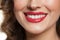 Female smiling lips with red lipstick makeup