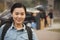 Female smiling student portrait in front of dormitory at college