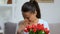 Female sniffing red flowers bouquet aroma and sneezing suffering allergy, health