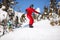 Female snowboarder on mountain slope