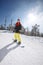 Female snowboarder snowboarding in mountain