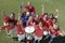 Female Soccer Team Holding Trophy