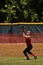 Female softball player prepares to catch ball