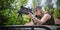 Female soldier shooting with sniper rifle. Woman with weapon