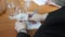 Female sommelier tasting alcohol drink in distillery. Woman is drinking vodka. Woman holding glass of vodka and taking