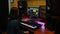 Female songwriter mixing and mastering at digital audio workstation. Sound engineer working at home music studio with monitors and