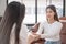 Female Southeast Asian psychologist doctor consults in a psychotherapy session with a female