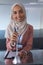 Female speaker in hijab looking at camera while speaking in a business seminar