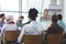 Female speaker with laptop speaks in a business seminar