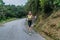 Female sport model running on road in mountains. Fitness woman training outdoors.