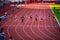 Female Sprinters Competing in 100m Race Under Stunning Sunset Light: Track and Field Event