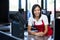 Female staff sitting at cash counter