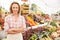 Female Stall Holder At Farmers Fresh Food Market