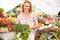 Female Stall Holder At Farmers Fresh Food Market