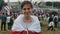 Female standing in front of camera during Protests in Belarus. People with apposition symbols and flags gathered for a