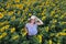 Female standing in sunflower field