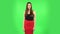 Female stands worrying in expectation then smiles with relief, carried. Green screen