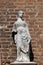 Female statue on the portal of Saint Eufemia church in Verona