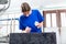 Female Stonemason applying inscription on tombstone