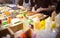 Female street vendor hands making sandwich outdoors. cuisine snacks, cooking fast food for commercial kitchen.