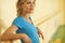 Female stretching in colorful fitness class with handrail