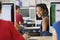 Female Student In Computer Laboratory With Classmates