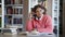 Female student doing homework and listening to music