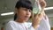 A female student holding a conical flask