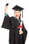 Female student holding diploma and taking selfie