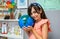 Female student hugging a handmade globe world at ecology classroom