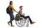 Female student pushing a male student in a wheelchair