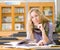 Female student reads the book in library