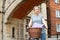 Female Student Riding Old Fashioned Bicycle Around Oxford University College Buildings By Bridge Of Sighs