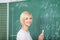 Female Student Solving Sums On Chalkboard In Classroom