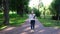 A female student stands alone in a Park in a mask during the epidemic. Safety, distance, health, N1H1, virus protection