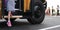 A female student steps off a school bus